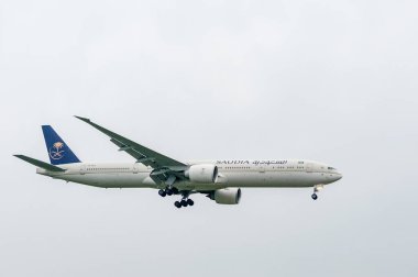 Saudia Saudi Arabia Airlines Boeing 777 HZ-AK21 landing in London Heathrow International Airport.
