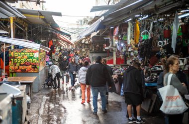 Tel Aviv Israel - December 07, 2018: Carmel Market in Tel Aviv, Israel. Rainy Day and People Selling Stuff