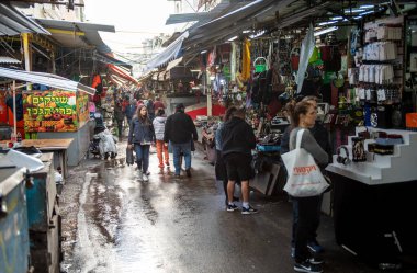 Tel Aviv Israel - December 07, 2018: Carmel Market in Tel Aviv, Israel. Rainy Day and People Selling Stuff