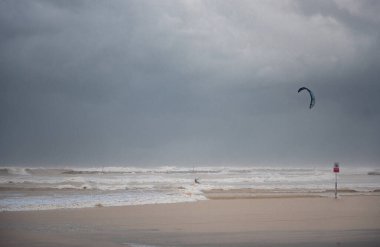 Stormy Mediterranean Sea and Cloudy Sky in Tel Aviv, Israel. Man with Power Kite