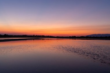 Beautiful Sunset in Croatia. Sunlight on the shore of Sea. Beautiful colors. Reflection
