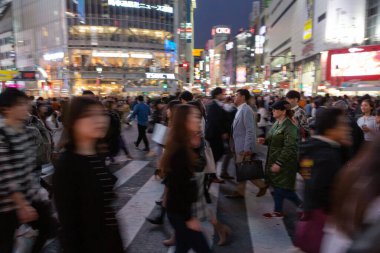 TOKYO, JAPAN - OCTOBER 30, 2019: Shibuya Crossing in Tokyo, Japan. The most famous intersection in the world. Blurry beacause of the panning.