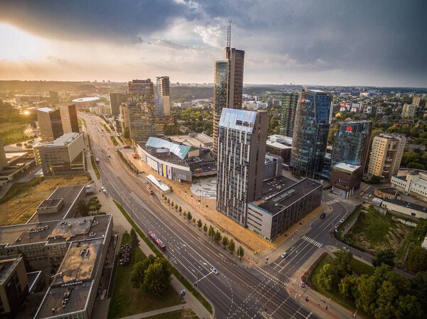 VILNIUS, LITHUANIA - AUGUST 03, 2018: Vilnius Cityscape and Business District in Background. Building of City Municipality and Skyscrapers in Background. Beautiful Sunset Time.