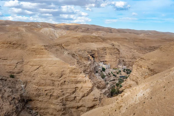 Wadi Qelt in Judaean desert around St. George Orthodox Monastery, or Monastery of St. George of Choziba, Israel. The sixth-century cliff-hanging complex.