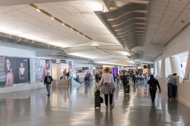 SAN FRANCISCO, CALIFORNIA - APRIL 04, 2019: San Francisco International Airport. People are walking towards the gates