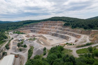 Stone Quarry in Croatia, Europe. Aerial View of Opencast Mining Quarry With Lots of Machinery. View from Above. Marble Mining Industry.