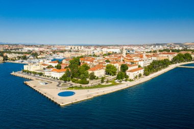 Aerial shot of Zadar old town, famous tourist attraction in Croatia. Waterfront aerial summer view, Dalmatia region of Croatia. Drone.