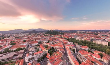 Graz Cityscape in Austria. Graz is the capital city of the southern Austrian province of Styria. At its heart is Hauptplatz, the medieval old town main square. Beautiful Sunset Light. Drone.