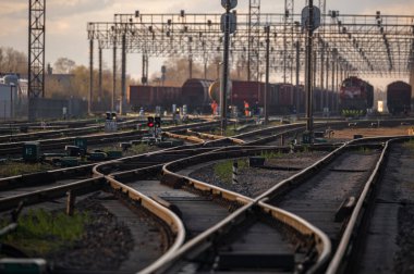 Railway Network In Lithuania. Radviliskis is well known railway capital in Lithuania. Beautiful evening sunset light and cars in background.
