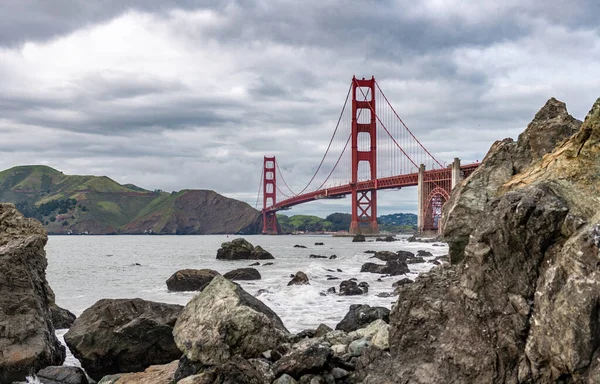Golden Gate Bridge in San Francisco, California. The Golden Gate Bridge is a suspension bridge spanning the Golden Gate, the one-mile-wide strait connecting San Francisco Bay and the Pacific Ocean. Baker Beach in Background. USA