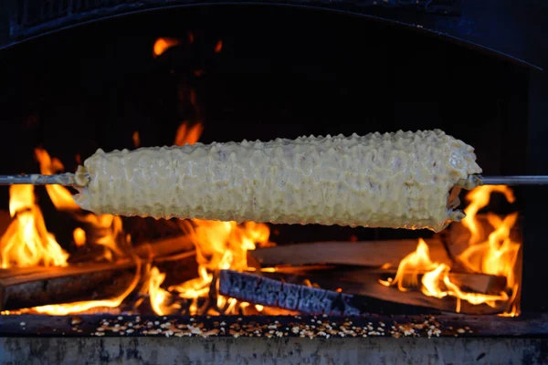 stock image Sakotis is a Polish Lithuanian traditional spit cake. It is a cake made of butter, egg whites and yolks, flour, sugar, and cream, cooked on a rotating spit in an oven or over an open fire