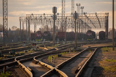 Railway Network In Lithuania. Radviliskis is well known railway capital in Lithuania. Beautiful evening sunset light and cars in background.