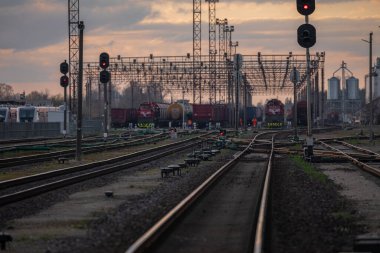 Railway Network In Lithuania. Radviliskis is well known railway capital in Lithuania. Beautiful evening sunset light and cars in background.