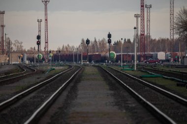 Railway Network In Lithuania. Radviliskis is well known railway capital in Lithuania. Beautiful evening sunset light and cars in background.