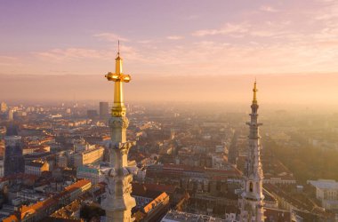 Golden Cross of Zagreb Cathedral in Croatia. It is on the Kaptol, is a Roman Catholic institution and the tallest building in Croatia. Sacral building in Gothic style. Cityscape in Background