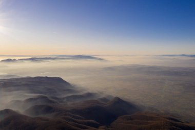 Zagreb Skyline in Croatia. Sunset Light Colorful Sky and Castle in Background. View from the top of Medvednica Mountain. Haze Background.