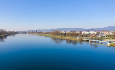 Beautiful Jarun Lake in Zagreb, Croatia with Zagreb Cityscape in Background.