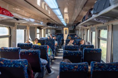 SOUSSE - TUNISIA, JUNE 15, 2019: Train interior in Tunisian Railway Network. 1st Class Carriage with people traveling to Tunis.