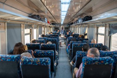 SOUSSE - TUNISIA, JUNE 15, 2019: Train interior in Tunisian Railway Network. 1st Class Carriage with people traveling to Tunis.