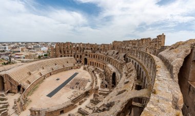 Amphitheatre of El Jem in Tunisia. Amphitheatre is in the modern-day city of El Djem, Tunisia, formerly Thysdrus in the Roman province of Africa. It is listed by UNESCO since 1979 as a World Heritage Site