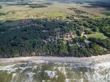 Baltic Sea in Lithuania. Karkle Town In Background