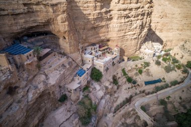 Wadi Qelt in Judean desert around St. George Orthodox Monastery, or Monastery of St. George of Choziba, Israel. The sixth-century cliff-hanging complex.