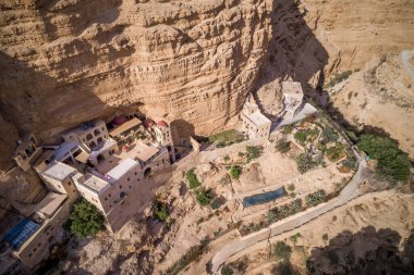 Wadi Qelt in Judean desert around St. George Orthodox Monastery, or Monastery of St. George of Choziba, Israel. The sixth-century cliff-hanging complex.