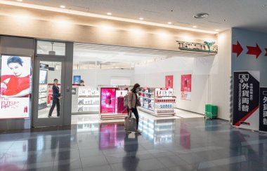 Tokyo International Haneda Airport. Departure Area with Duty Free Shops and People.