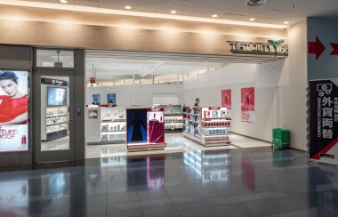 Tokyo International Haneda Airport. Departure Area with Duty Free Shops and People.