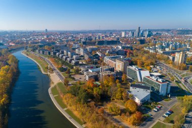 Vilnius Cityscape with Autumn Trees and Traffic. Lithuania