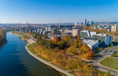 Vilnius Cityscape with Autumn Trees and Traffic. Lithuania
