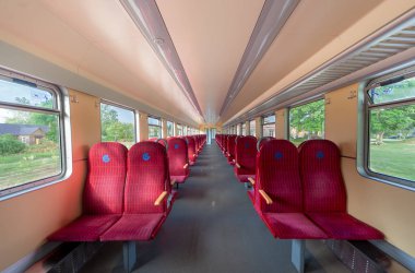 Lithuanian Train Car or Carriage. Empty Car and Red Seats. Empty Train.
