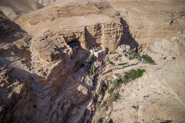 Wadi Qelt in Judean desert around St. George Orthodox Monastery, or Monastery of St. George of Choziba, Israel. The sixth-century cliff-hanging complex.