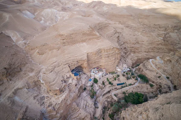 Wadi Qelt in Judean desert around St. George Orthodox Monastery, or Monastery of St. George of Choziba, Israel. The sixth-century cliff-hanging complex.
