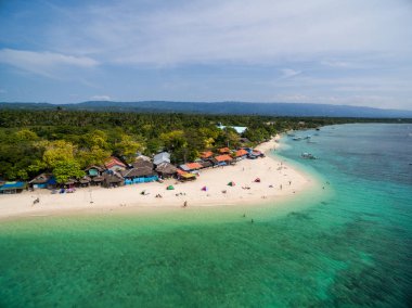White Beach Moalboal in Cebu, Palawan, Philippines. Boat and Ocean Water and Beach. Drone