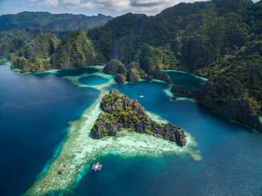Twin Lagoon in Coron, Palawan, Philippines. Mountain and Sea. Lonely Boat. Tour A. Drone