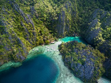 Twin Lagoon in Coron, Palawan, Philippines. Mountain and Sea. Lonely Boat. Tour A. Drone