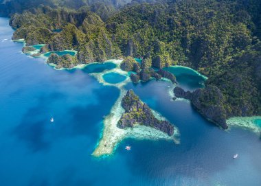 Twin Lagoon in Coron, Palawan, Philippines. Mountain and Sea. Lonely Boat. Tour A. Drone