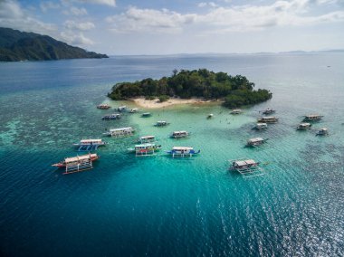 CYC beach in Coron, Palawan, Philippines. Corn Youth Club Beach. Mountain and Sea in background. Tour A. Drone
