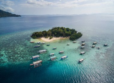 CYC beach in Coron, Palawan, Philippines. Corn Youth Club Beach. Mountain and Sea in background. Tour A. Drone