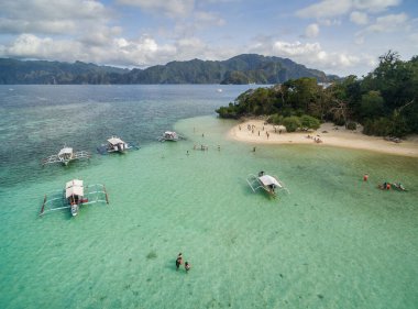 CYC beach in Coron, Palawan, Philippines. Corn Youth Club Beach. Mountain and Sea in background. Tour A. Drone