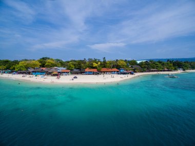White Beach Moalboal in Cebu, Palawan, Philippines. Boat and Ocean Water and Beach. Drone
