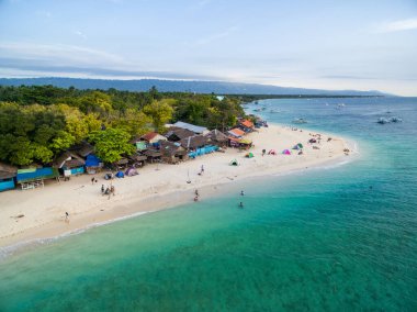 White Beach Moalboal in Cebu, Palawan, Philippines. Boat and Ocean Water and Beach. Drone