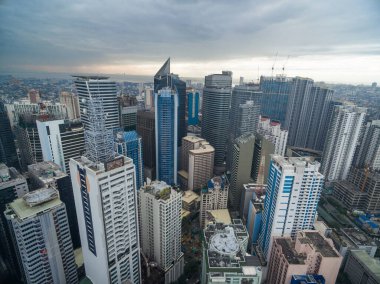 Manila Cityscape, Makati City with Business Buildings and Cloudy Sky. Philippines. Skyscrapers in Background.