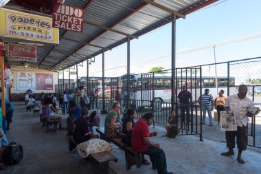 Belize City Bus Station with Local People