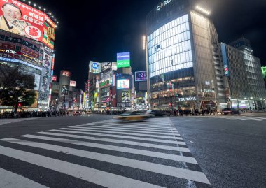 Shibuya District in Tokyo. Famous and busiest intersection in the world, Japan. Shibuya Crossing. Blurry Panning Car