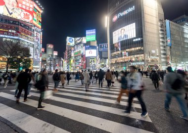 Shibuya District in Tokyo. Famous and busiest intersection in the world, Japan. Shibuya Crossing. Blurry Panning Car