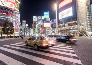 Shibuya District in Tokyo. Famous and busiest intersection in the world, Japan. Shibuya Crossing. Blurry Panning Car
