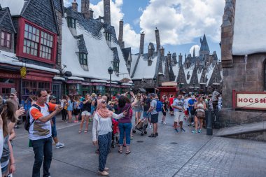 Butterbeer and Harry Potter Hogsmeade in Universal Resort Orlando, Florida. People Doing Selfies.