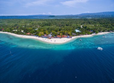 White Beach Moalboal in Cebu, Palawan, Philippines. Boat and Ocean Water and Beach. Drone